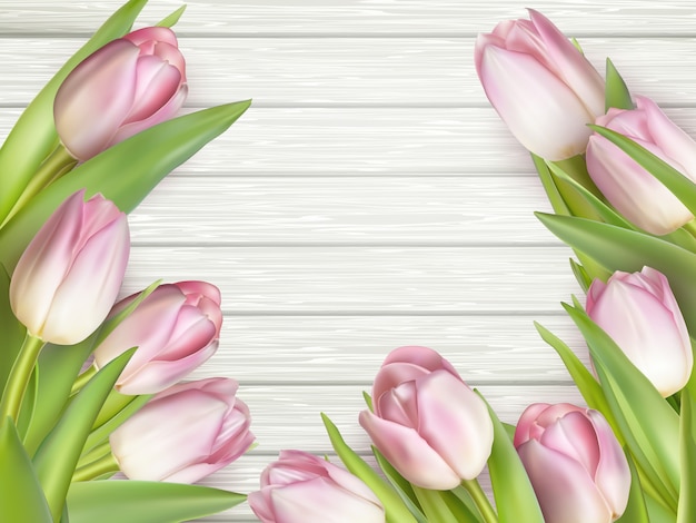 Bouquet of pink tulips on wooden background