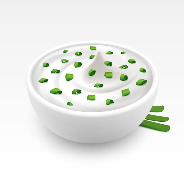 bowl of sour cream sauce tartar mayonnaise with chopped green onion on white