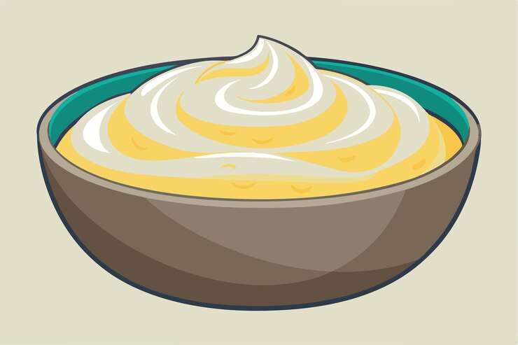वेक्टर a bowl of whipped cream sits on a table with a bowl of cream