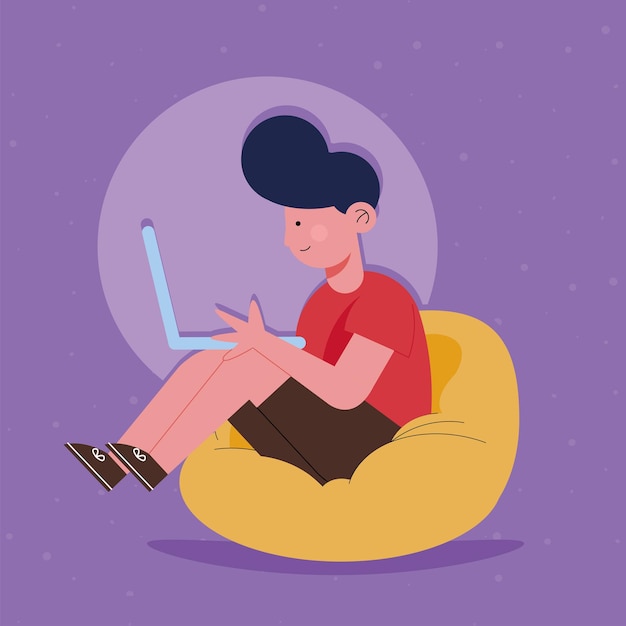 boy in couch using laptop