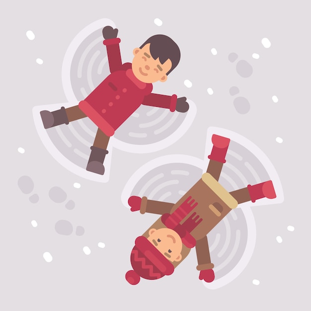 Boy and girl making snow angels