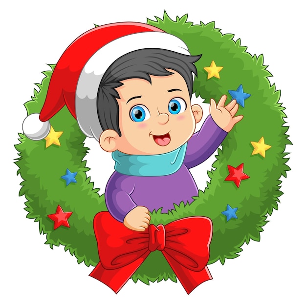 The boy is come out from the christmas wreath and waving the hand