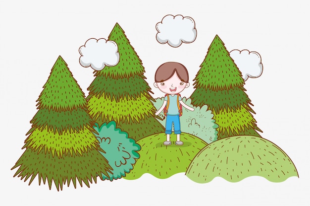 Boy in the mountains with clouds and pine trees