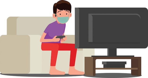 A boy playing video games wearing face mask