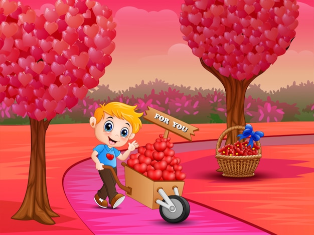 Boy pushing a pile of hearts in wood trolley