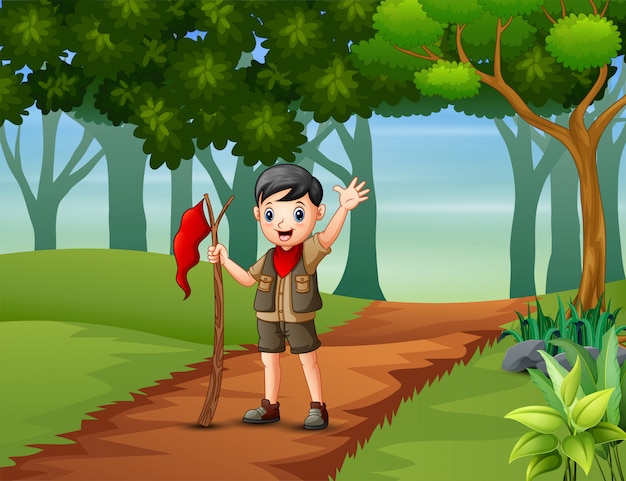 Boy scout hiking in the forest background
