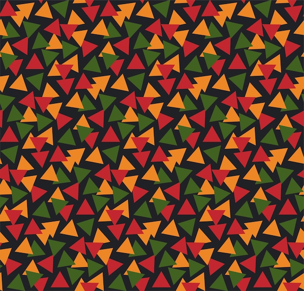 Яркий абстрактный геометрический бесшовный узор с треугольниками в традиционных африканских цветах