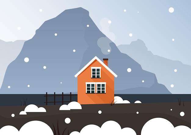 A bright orange small house stands in the snow and behind the blue mountains