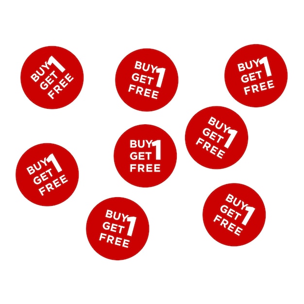 A bunch of red round stickers that say buy 1 free.