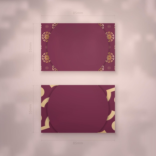 Burgundy business card with abstract gold pattern for your contacts