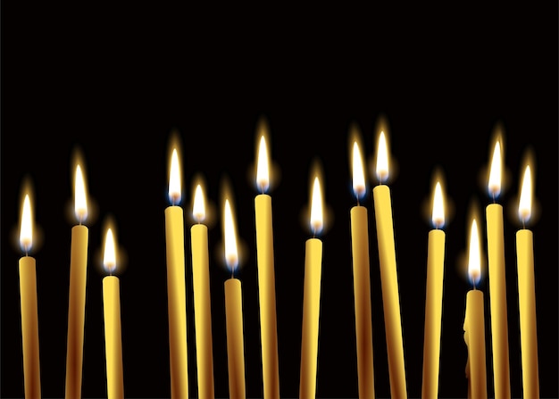 Vettore candele accese su sfondo nero