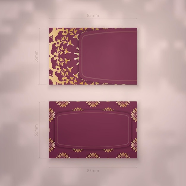 Business card in burgundy color with abstract gold pattern for your business.