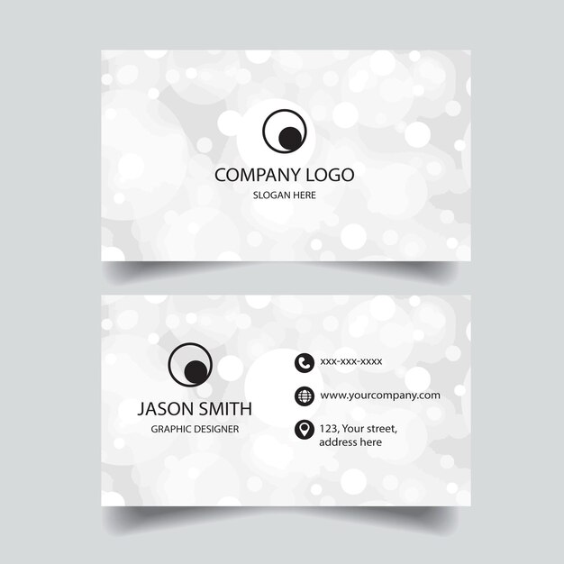 A business card for company logo with a silver background.