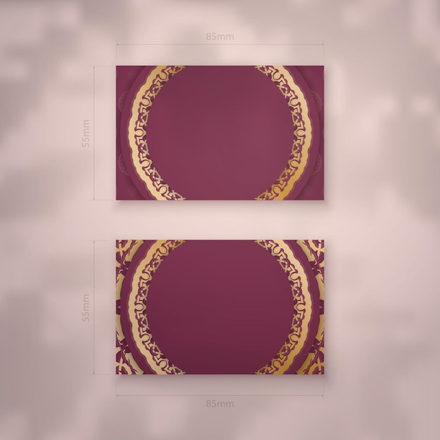 Business card template in burgundy color with luxurious gold ornaments for your personality.