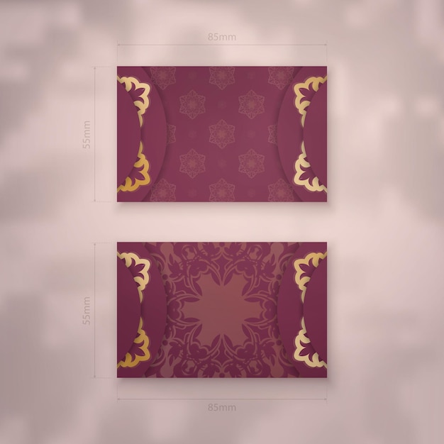 Vector business card template in burgundy color with vintage gold ornaments for your business.