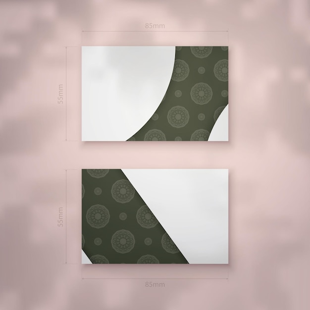 Vector business card template in dark green color with indian white ornaments for your business.