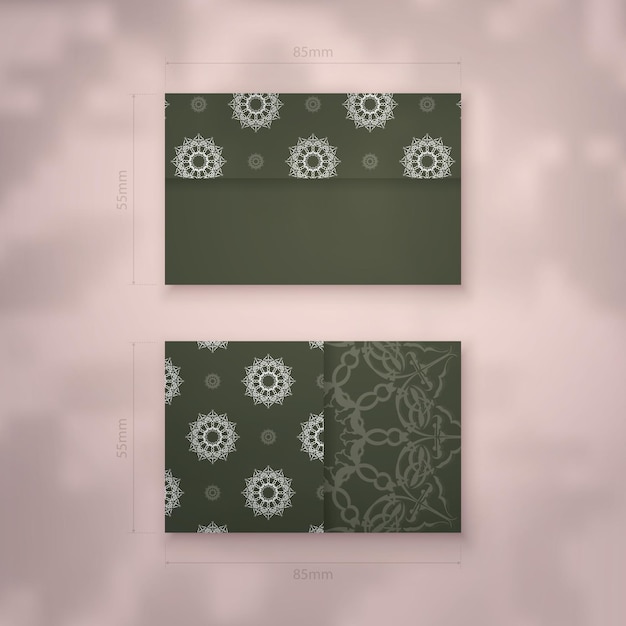 Business card template in dark green color with vintage white ornaments for your brand.