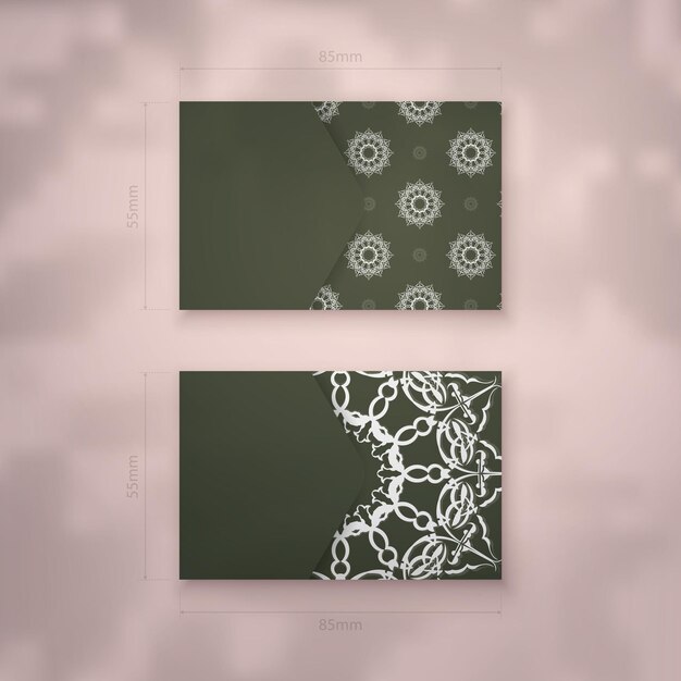 비즈니스를 위한 빈티지 흰색 패턴이 있는 짙은 녹색 색상의 명함 템플릿.