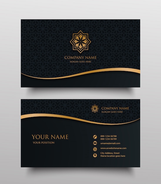 Business card with gold floral ornamental logo and place for text on dark background