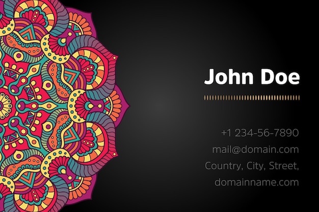 Business card with gold mandala design