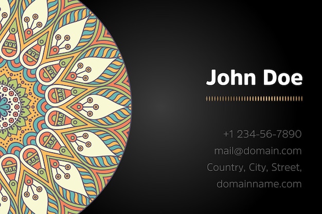 Business card with gold mandala design