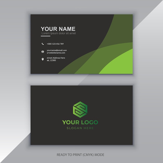 A business card with a green logo and a cube