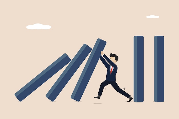business crisis management risk protection businessman helps stop dominoes falling