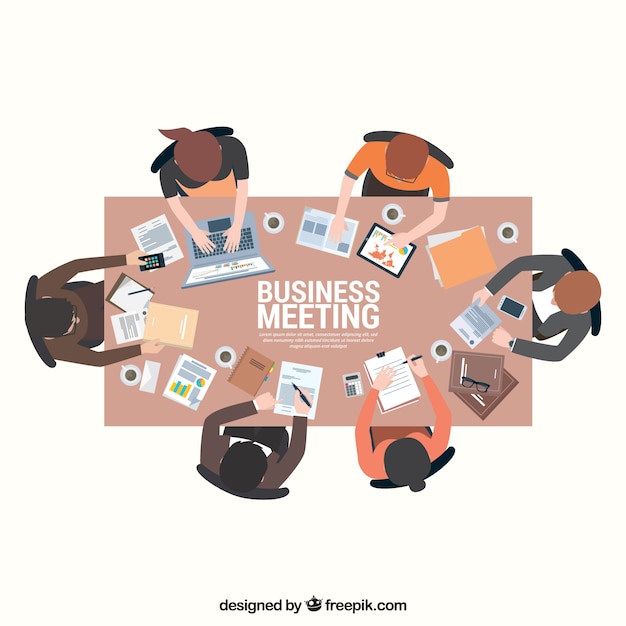 Business meeting scene on rectangular table