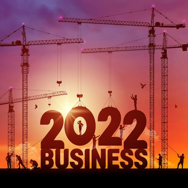 Business in the new year 2022. vector illustration business finance background. 2022 construction site crane building a business text idea concept. black silhouette illustration design.