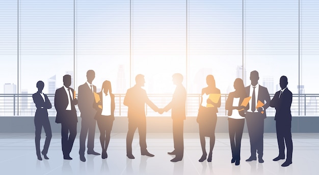 Vector business people group meeting agreement hand shake silhouettes modern office building interior