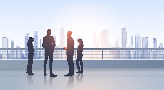 Business People Group Silhouettes Over City Landscape Modern Office Buildings