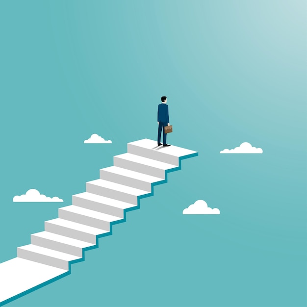 Businessman achievement concept. a man standing on top of a stair.
