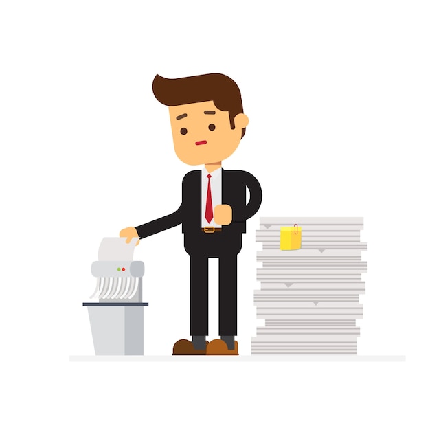 Businessman shredding old files