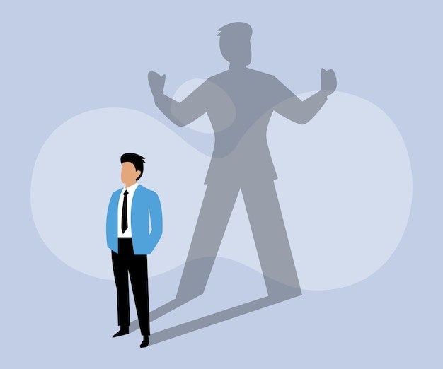 Businessman standing and casting a shadow of a strong superhero