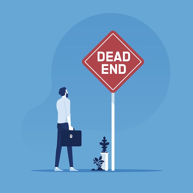 Businessman standing at the end of road with dead end signage concept of wrong decision in business