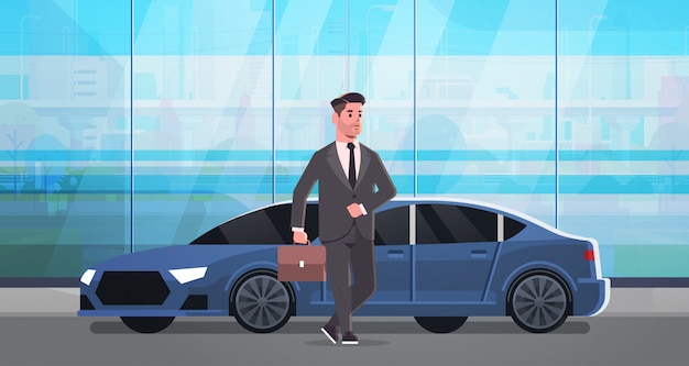 бизнесмен стоит возле роскошного автомобиля человек в костюме держит чемодан собирается работать бизнес