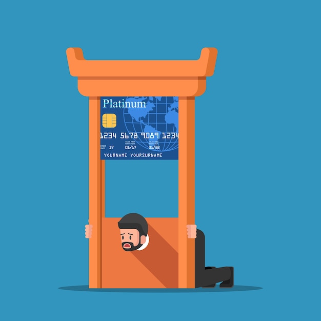 Businessman stuck in credit card guillotine.