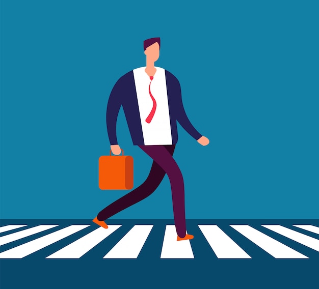 Businessman walking crosswalk