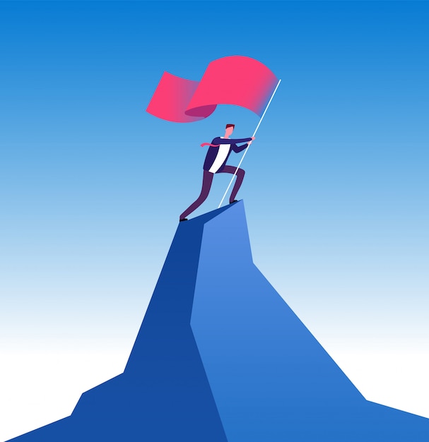 businessman with flag on mountain peak