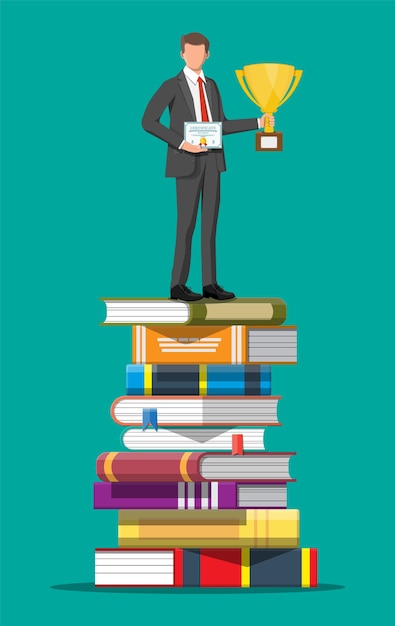 Businessman with trophy on stack of books.