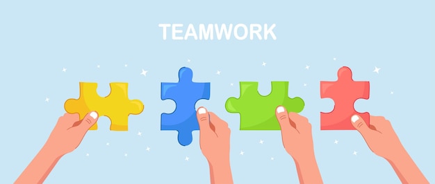 Businessmen hold in hands  the pieces of jigsaw puzzle and connect it. team work business metaphor. teamwork, success concept