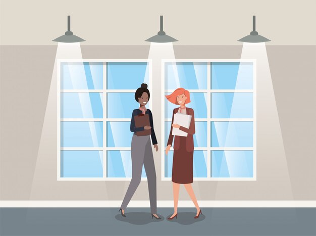 Businesswomen couple in corridor office