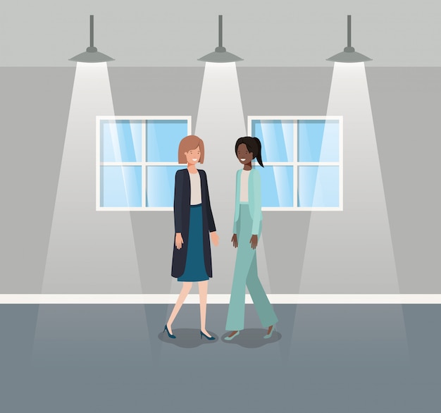 Businesswomen couple in corridor office