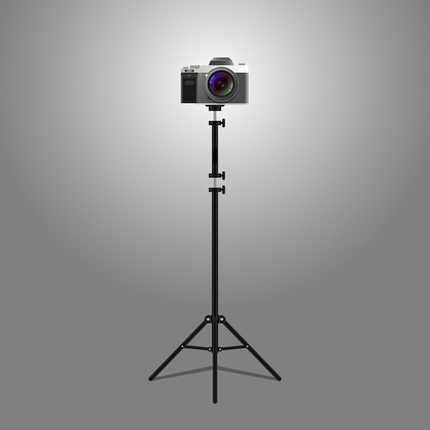 A camera on a tripod that is black and white