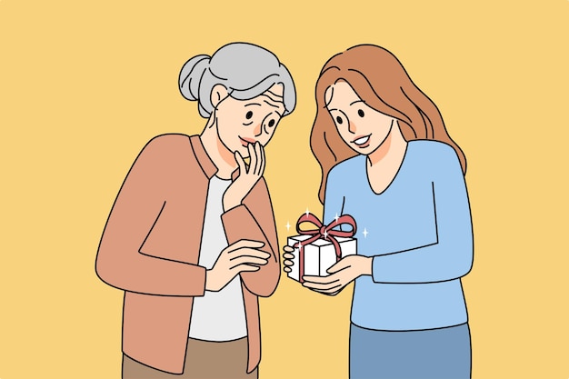 Caring young woman greeting elderly grandmother