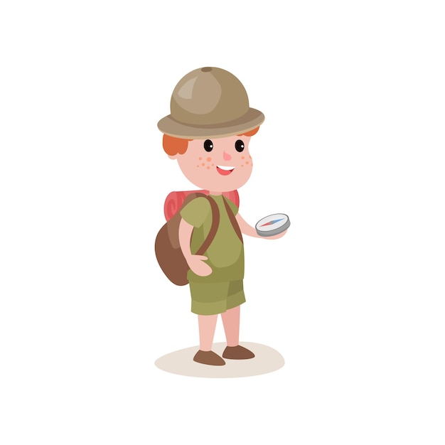 Cartoon boy scout holding compass in hand and backpack on his shoulders. Young explorer looking for way. Dressed in khaki uniform and hat. Scouting concept. Flat vector illustration isolated on white