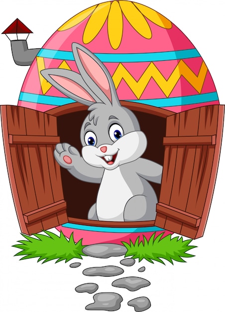 Cartoon bunny with decorated easter eggs house