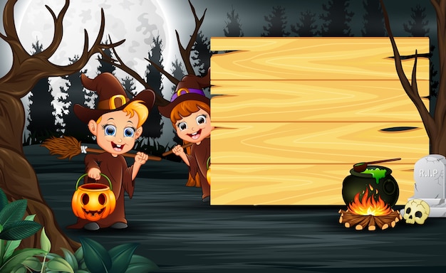 Cartoon of couple witch standing beside wooden board