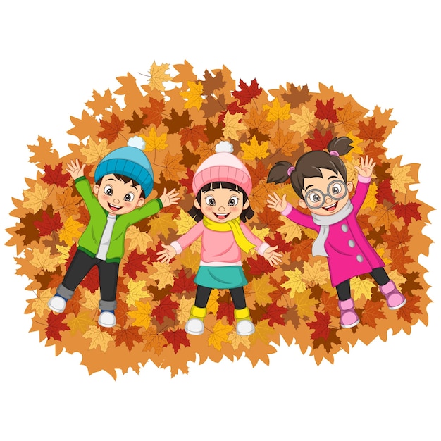 Vettore bambini felici del fumetto che si trovano sui fogli di autunno variopinti