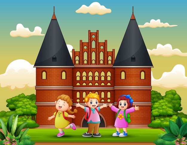 Cartoon of happy school children standing in front of holstentor building